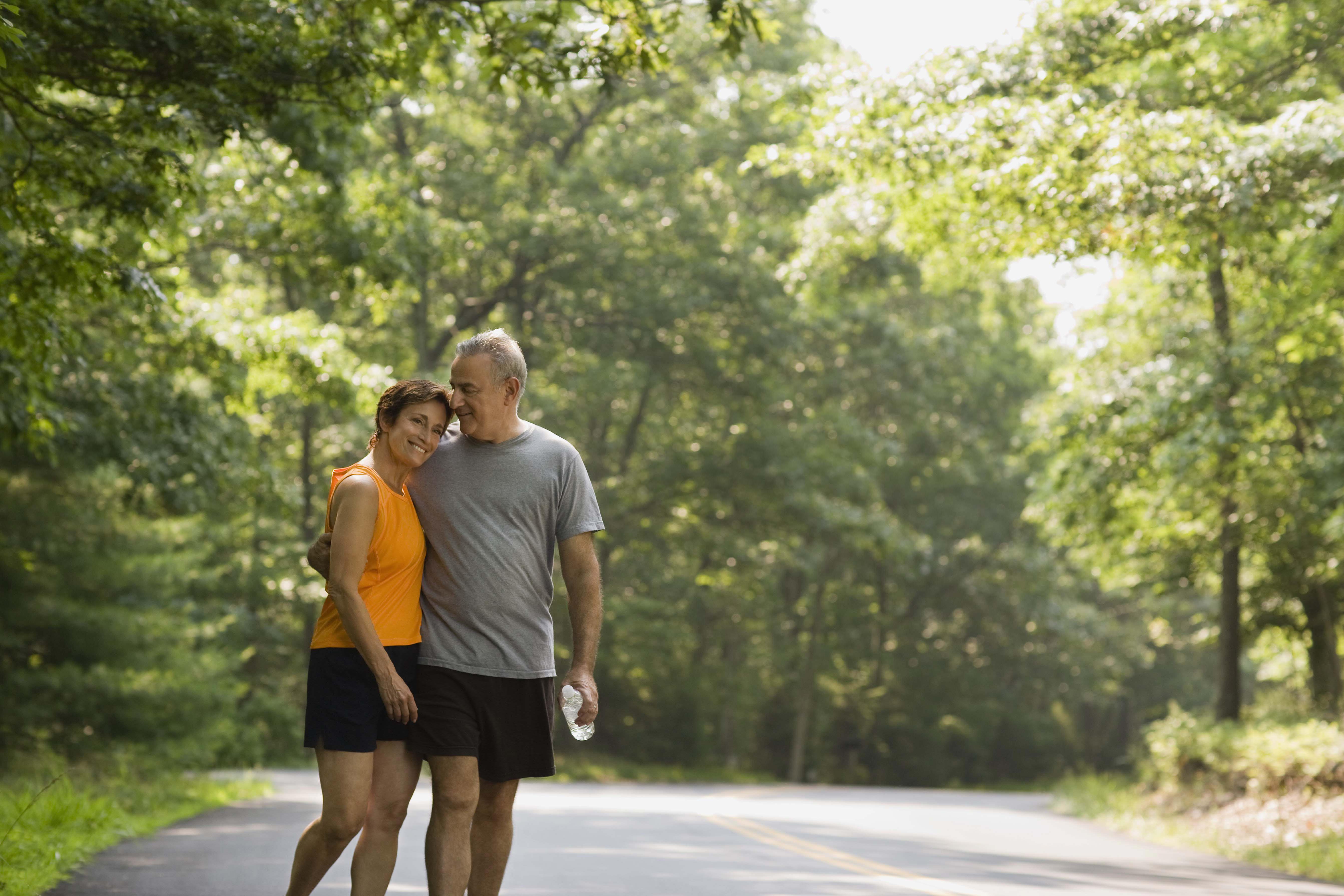 Couple exercising on road