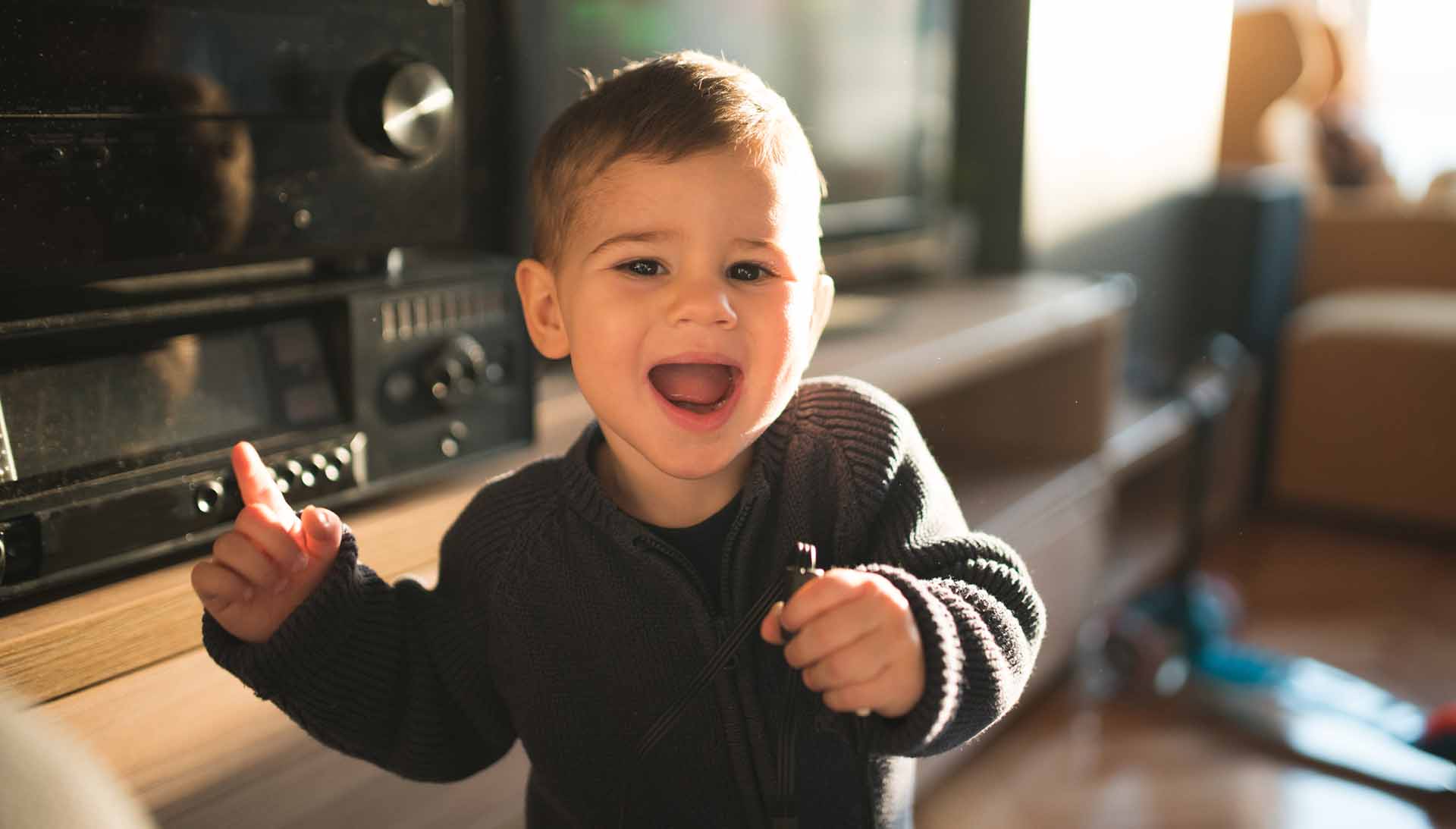 Baby boy dancing at home and singing