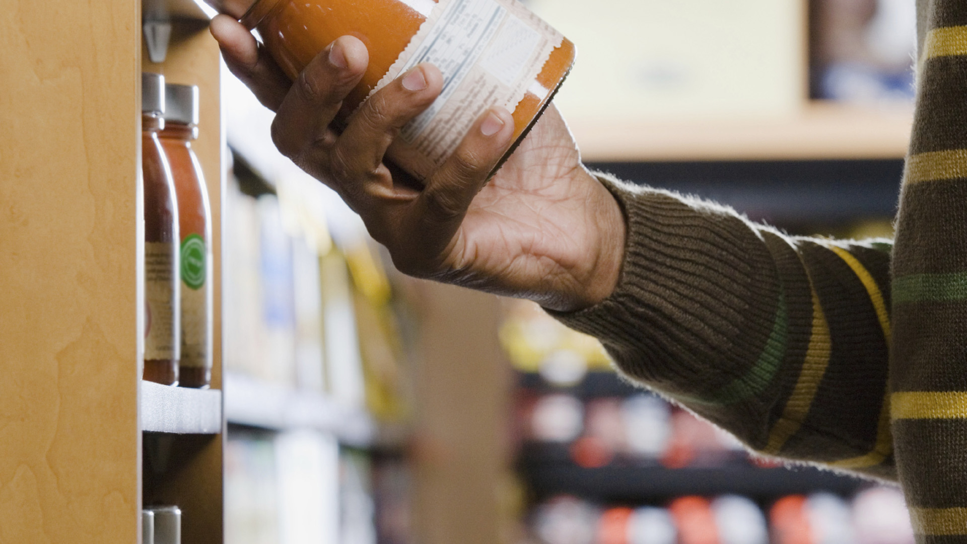 A man holding a jar