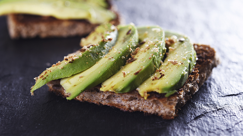 sliced avocado on toast bread with spices