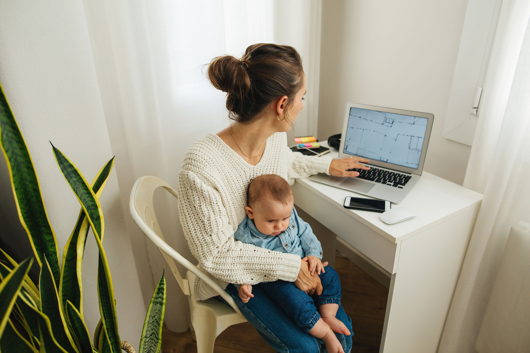 Freelance mother working at home.