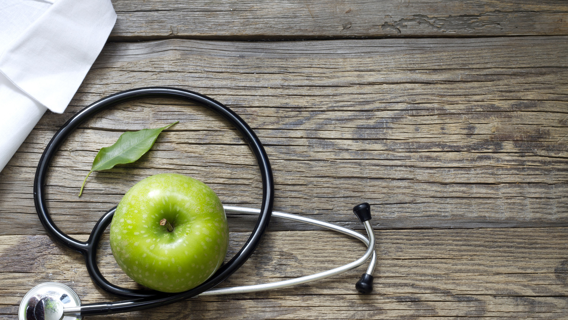 Alternative medicine stethoscope and green symbol background