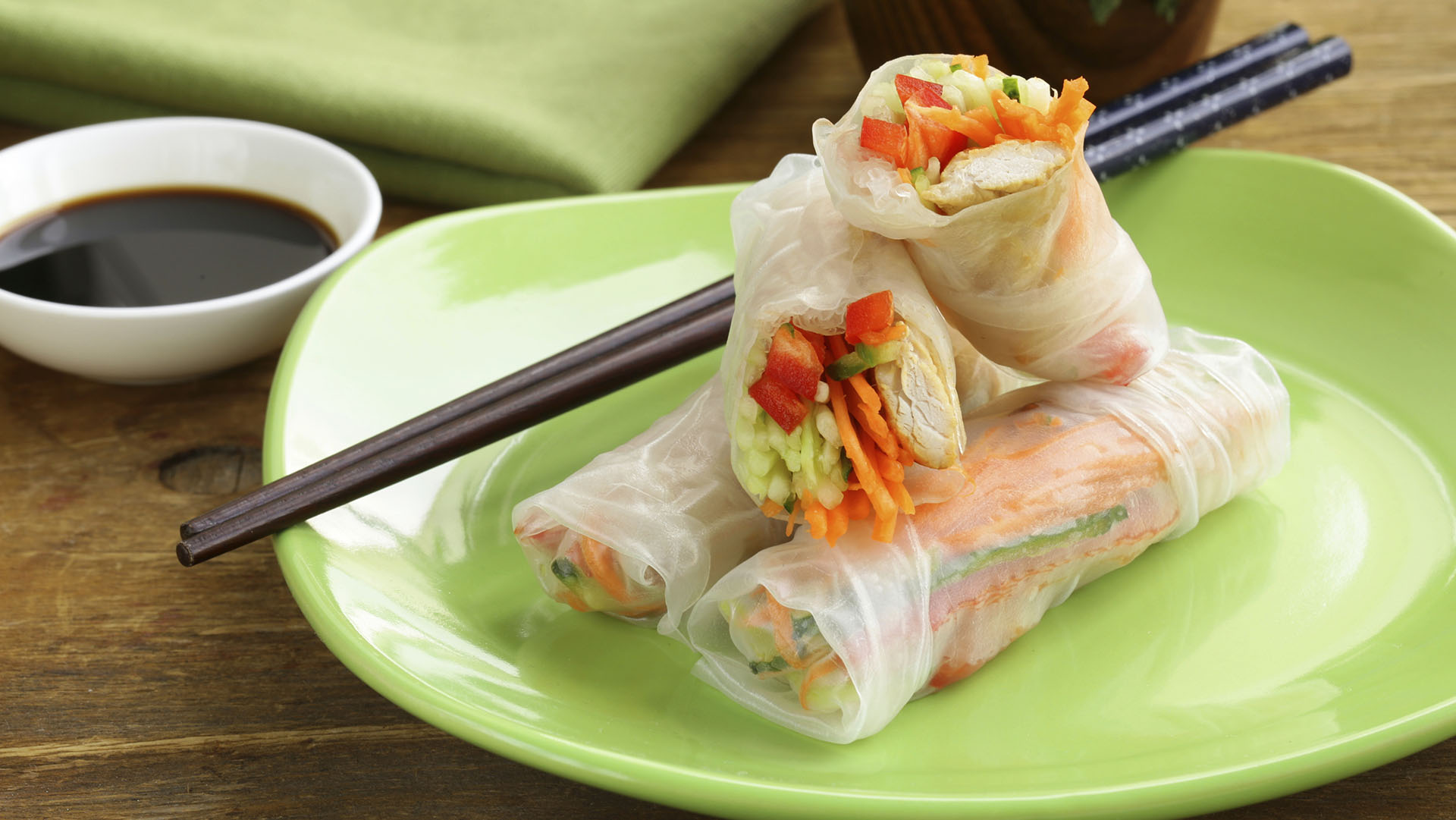 spring rolls with vegetables and chicken on a plate