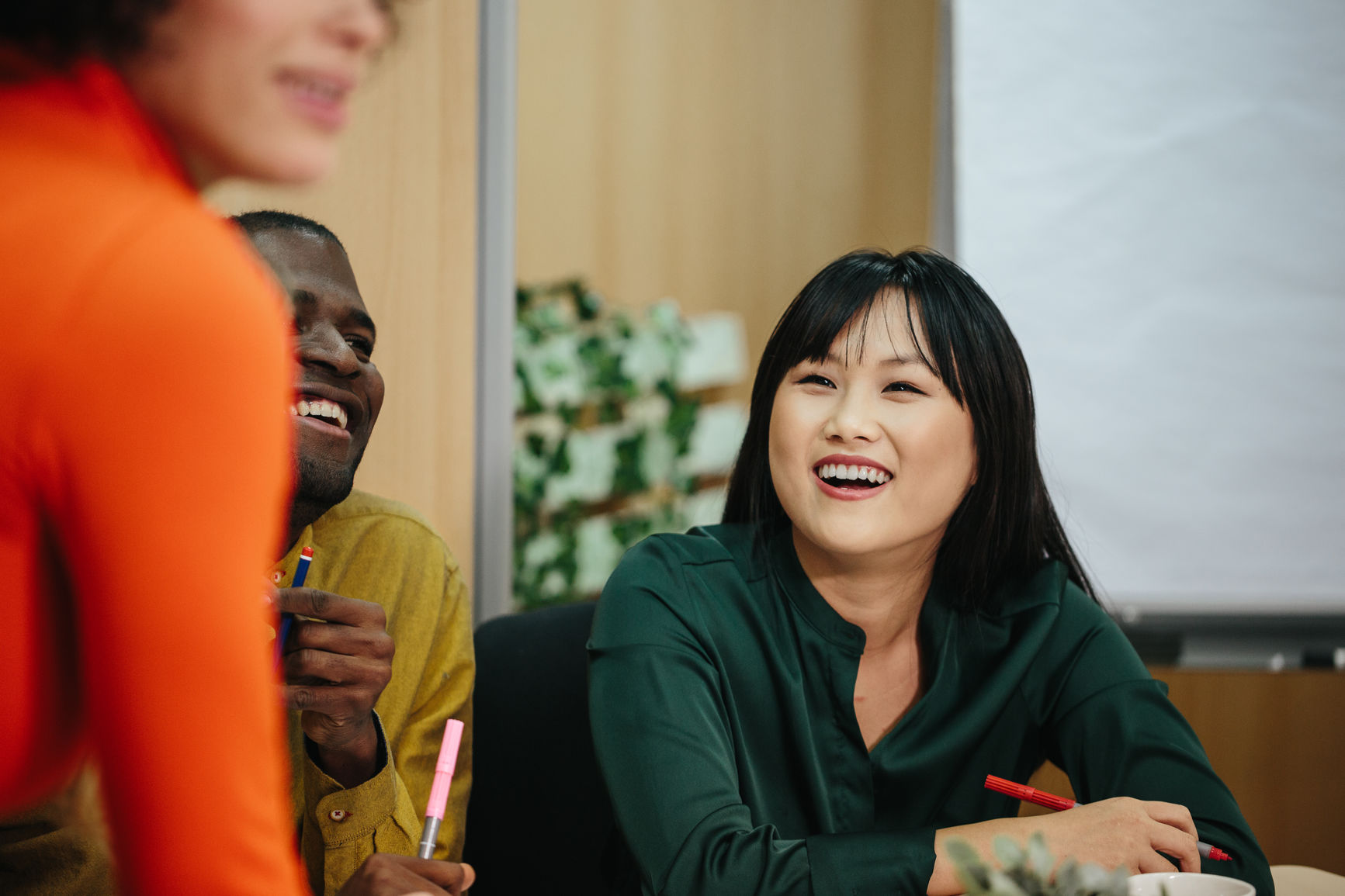 Young modern chinese woman in a meeting at the office