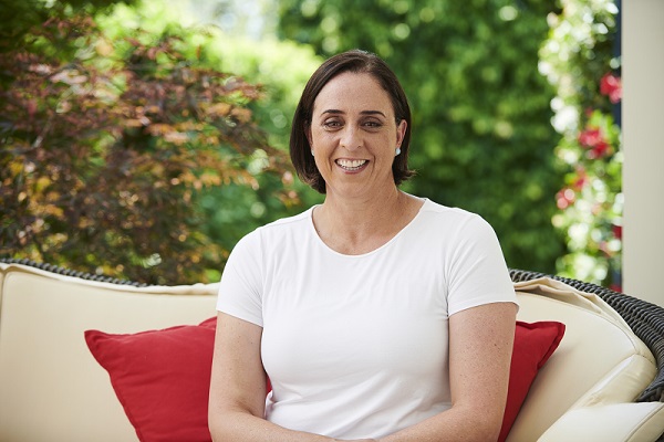 Nicole Livingstone sitting on a sofa