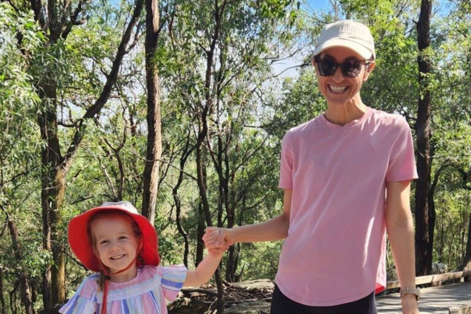 A group of people walking outside participating in parkrun