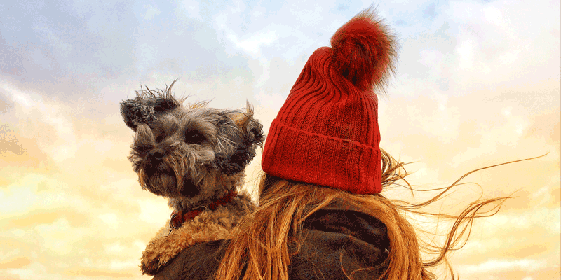 Girl holding dog