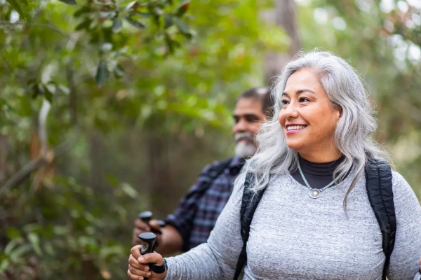 Couple hiking outside smiling