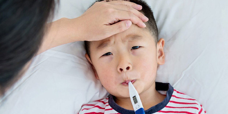 A child having their temperature taken A child having their temperature taken