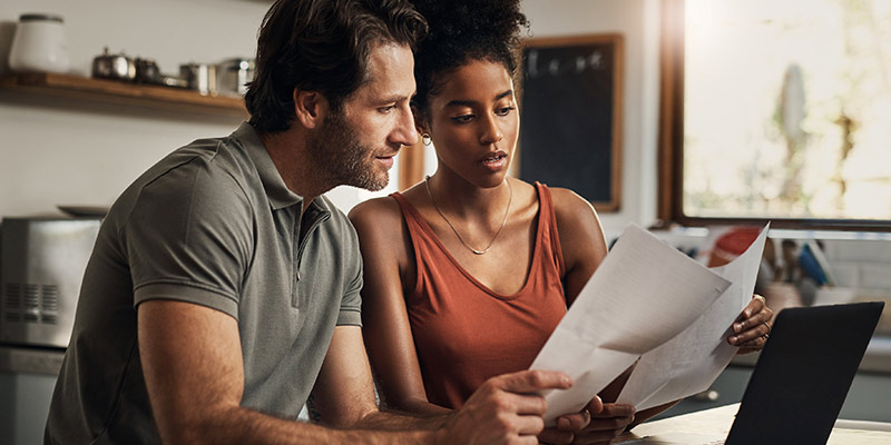 A couple researching what is included in their cover