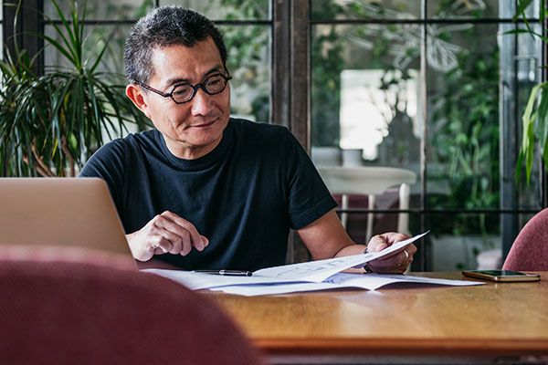 Man reviewing information on paper