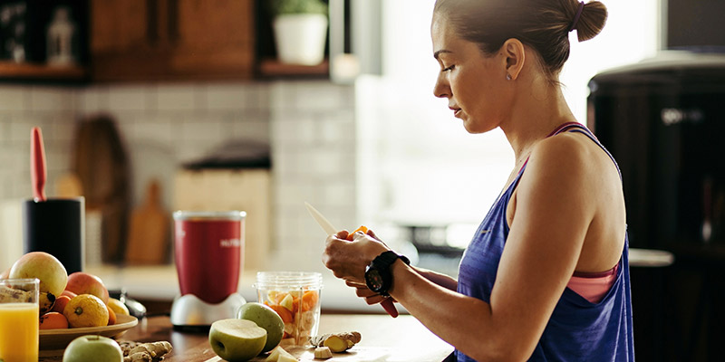 a woman preparing healthy foods 