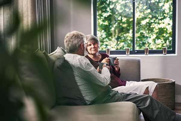 Couple discussin on couch