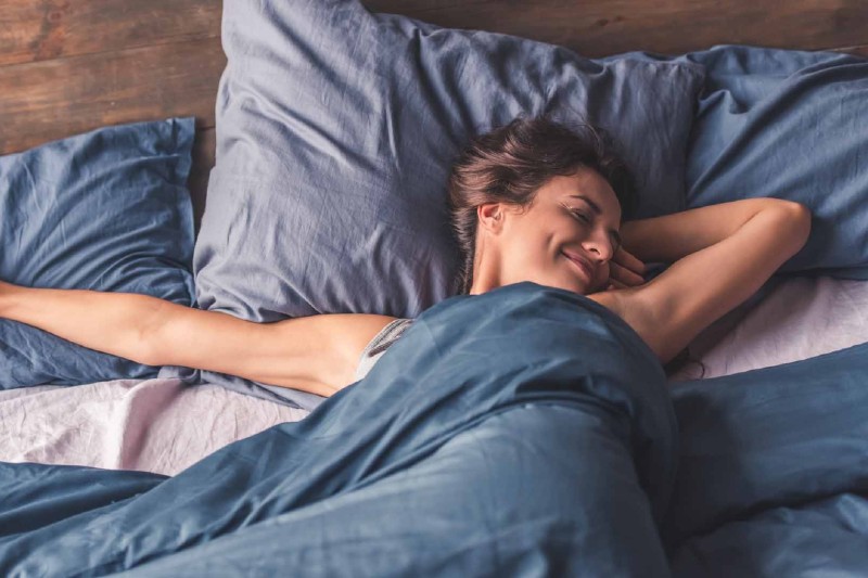 woman in bed waking up