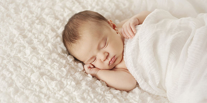 A sleeping newborn A sleeping newborn