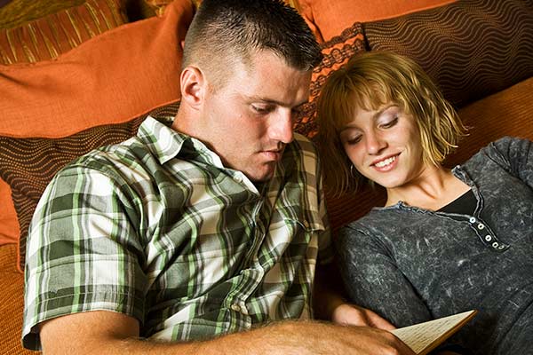 A couple researching their cover