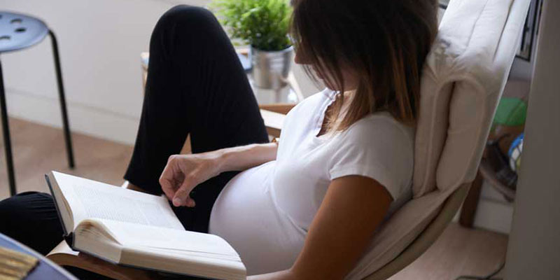 Pregnant woman on couch