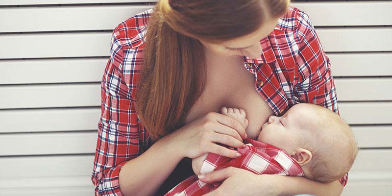 A mother breastfeeding her baby