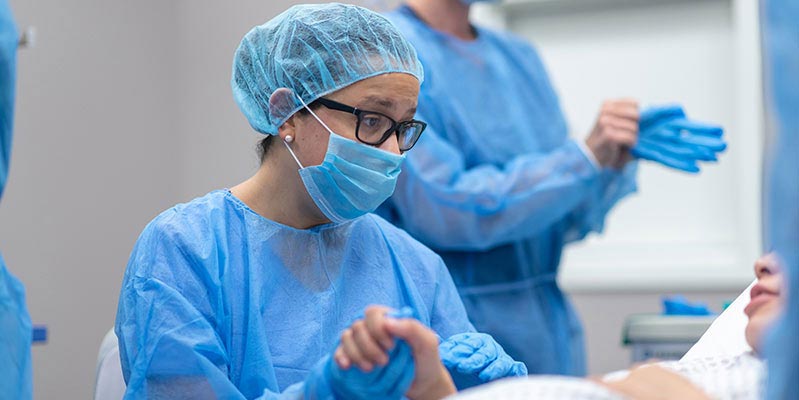 An image of a midwife in hospital with a pregnant woman An image of a midwife in hospital with a pregnant woman