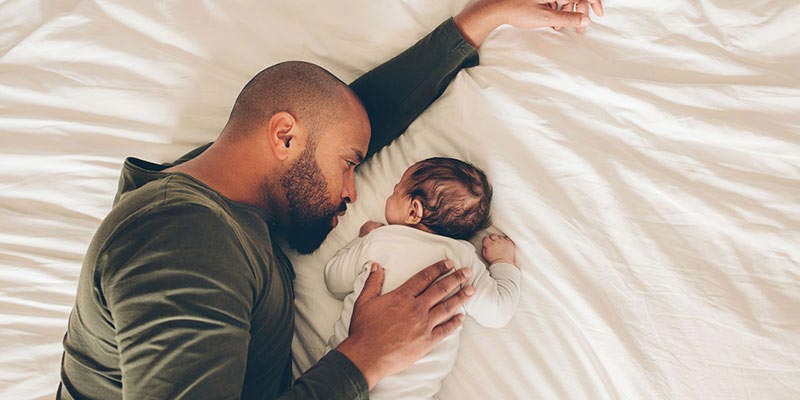 A father and baby cuddling