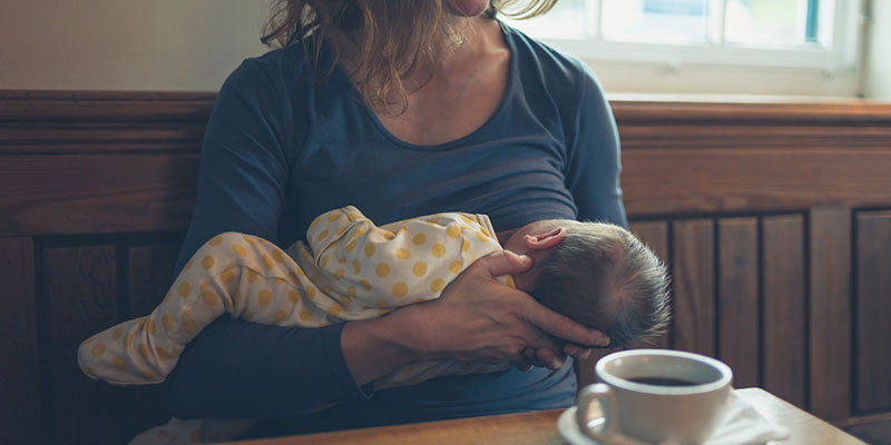 A mother breastfeeding her baby