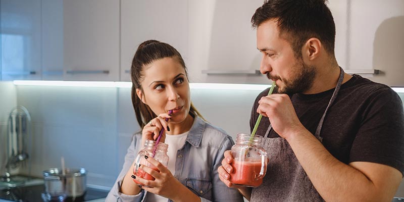 A couple drinking healthy smoothies