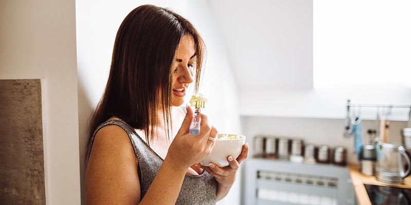 A woman eating her breakfast