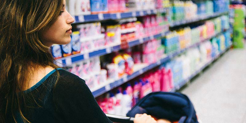 A woman shopping with her newborn