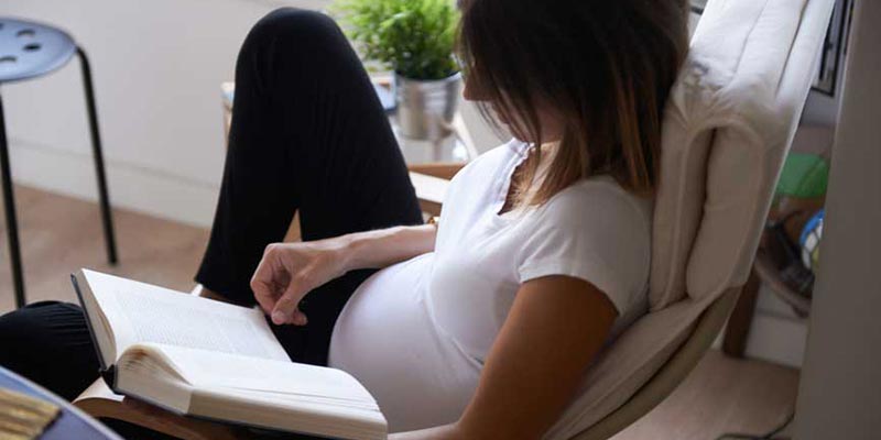 A pregnant woman on the couch A pregnant woman on the couch
