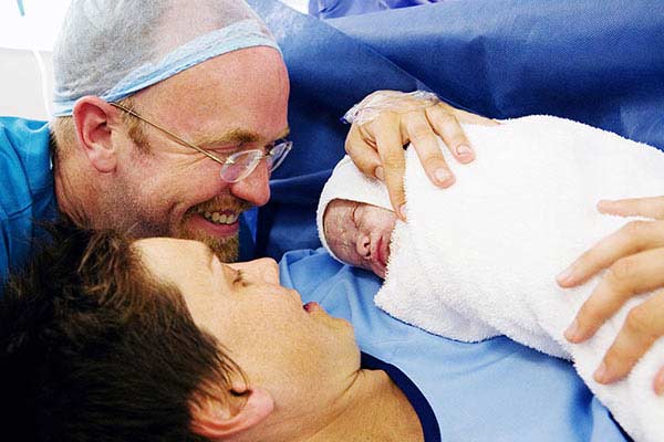 A couple with their newborn baby