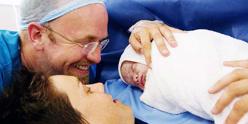 A couple with their newborn baby