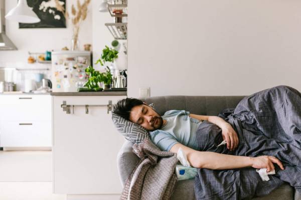 A person unwell on the couch