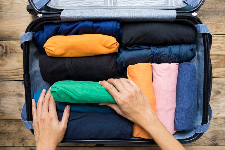 A suitcase with clothes packed A suitcase with clothes packed