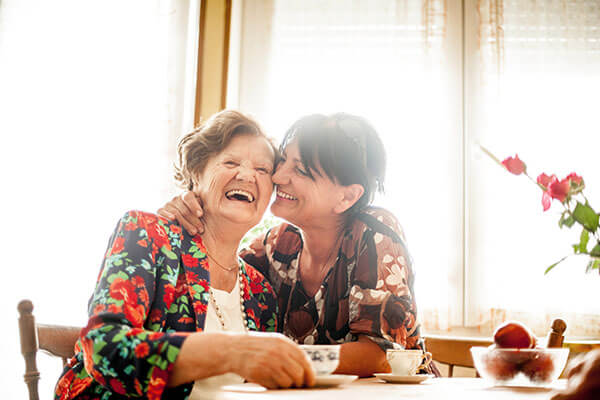 A mother and daughter embracing