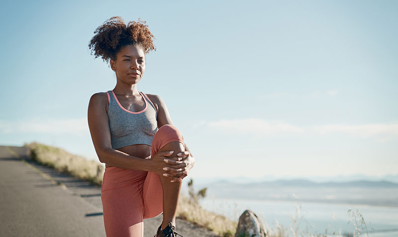 woman stretching outdoors