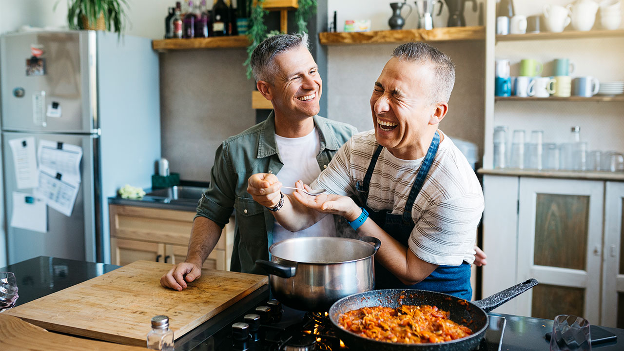 2 men cooking in the kitchen