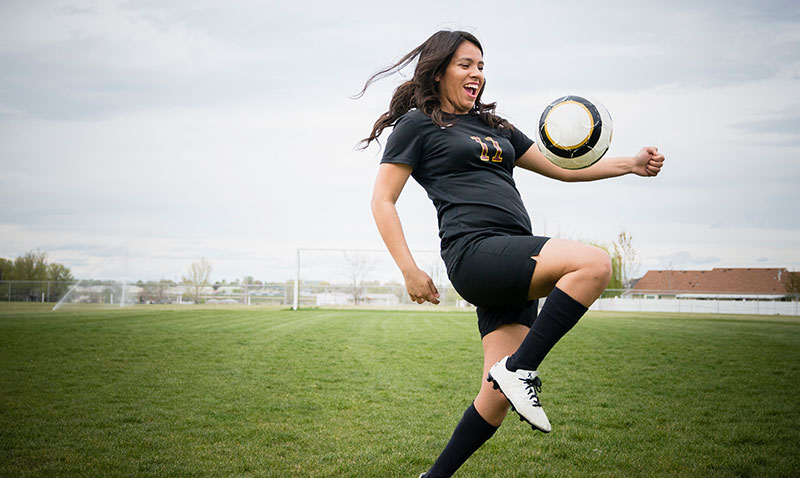 woman playing soccer