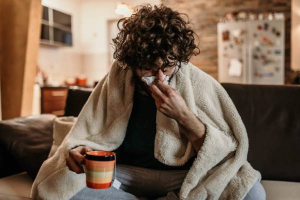 A person unwell on the couch