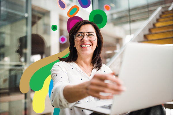 woman smiling on a laptop