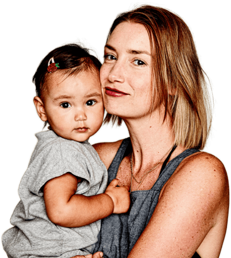 Woman holding little girl