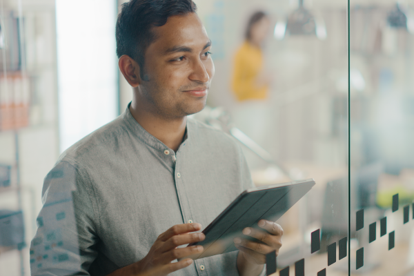 Worker using tablet to do work