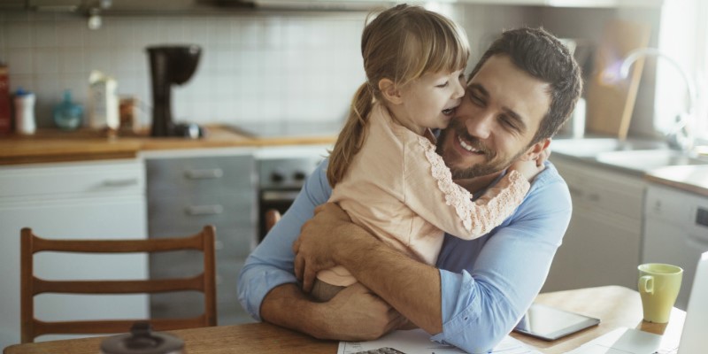 Man hugging his daughter