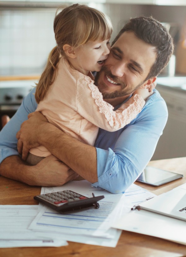Happy father hugging his daughter