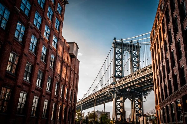 View of Brooklyn bridge through buildings