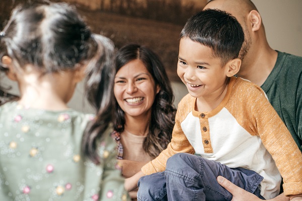 1092703810 Hispanic Family laughing together
