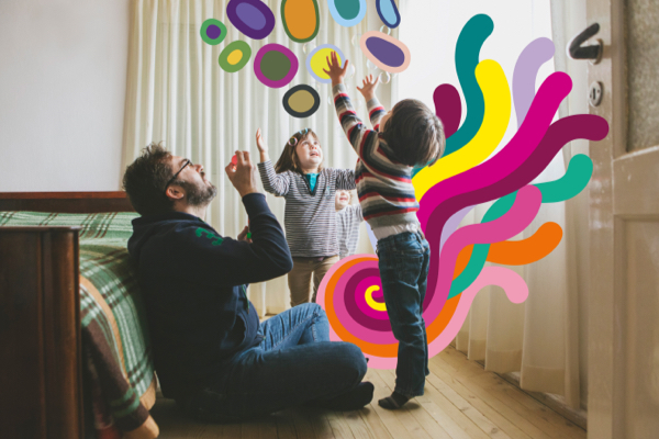 Father and two young children playing